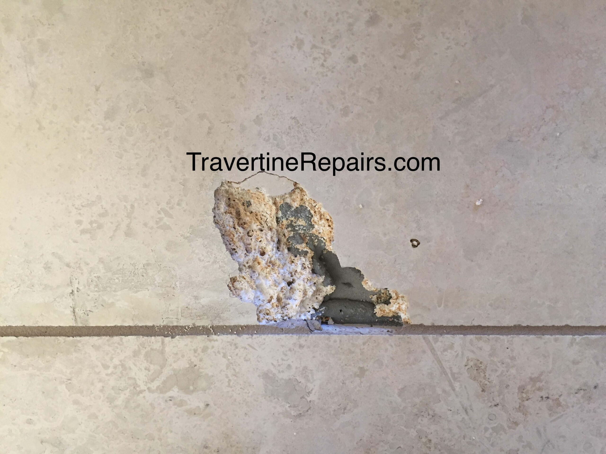 Tile Hole Before Repair